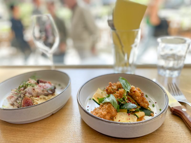 Appetizers of Pēlamide, celery remoulade, and figs (l) and Pork Katsu with marinated zucchini (r), photo by Annie Etheridge