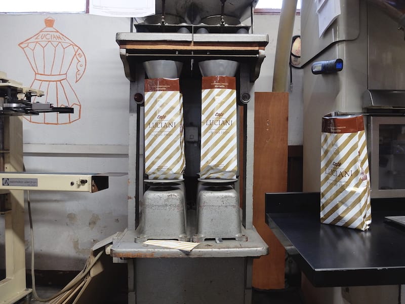 Packaging freshly roasted coffee beans at Café Luciani, photo by Alexis Steinman