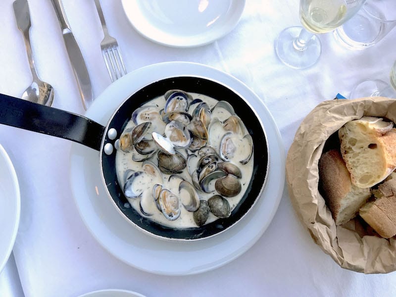 Chez Madie's signature palourdes au thym, local clams simmered in Provençal thyme and cream, photo by Alexis Steinman