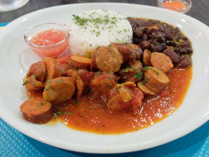 The rougail, smoked sausage in tomato sauce), at Le Tamarin photo by Alexis Steinman