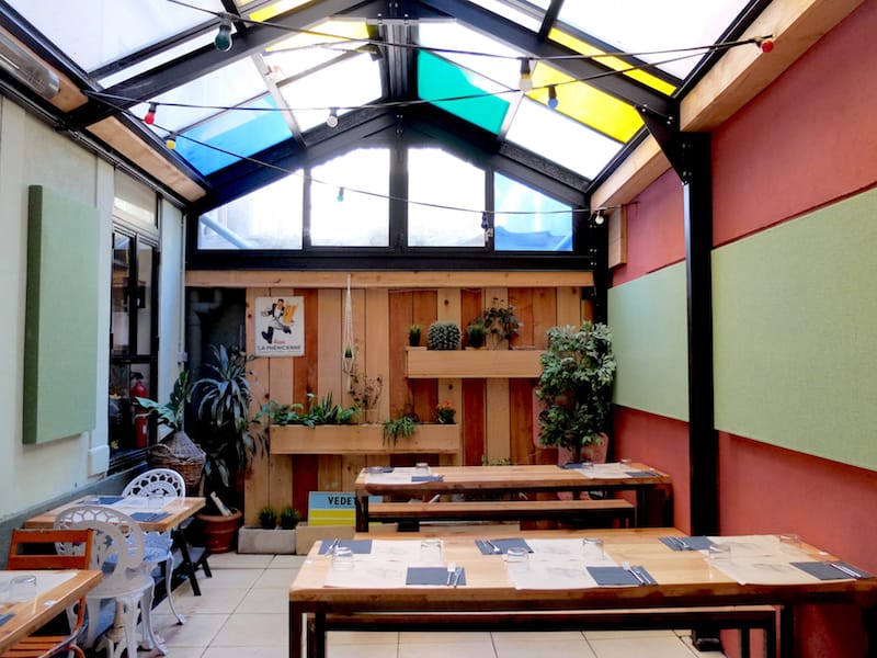 The cozy, plant-lined patio at Le Parpaing qui Flotte, photo by Alexis Steinman