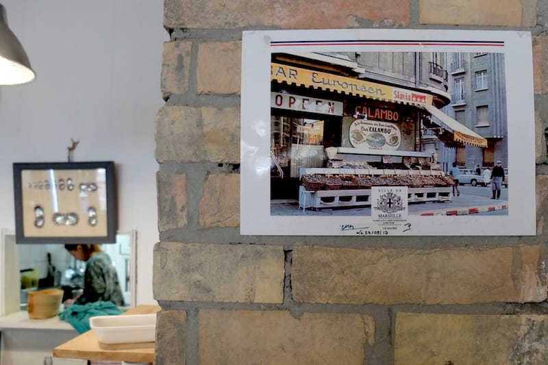 Old photos of Maison Calambo hang on the walls of this small écaillier, photo by Alexis Steinman