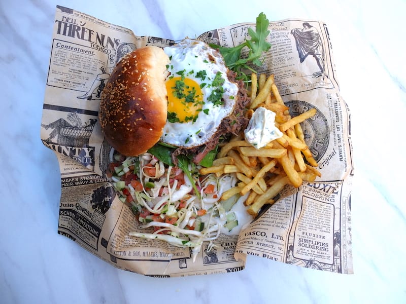 Yossi's melt-in-your-mouth assado piled atop a challah bun, one of the best sandwiches in Marseille, photo by Alexis Steinman