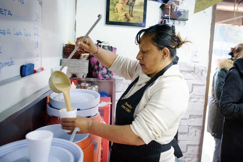 Serving up atole at Tamales Doña Emi, photo by PJ Rountree