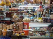 A stall selling beans, dried fruit, meat and cheeses in the Coyoacán market.