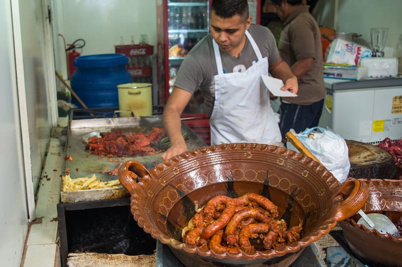 Grilling meat at Las Mas Altas Montañas, photo by Ben Herrera