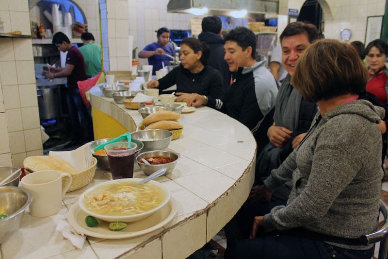A bowl of chicken soup and hibiscus juice, photo by Martha Pskowski
