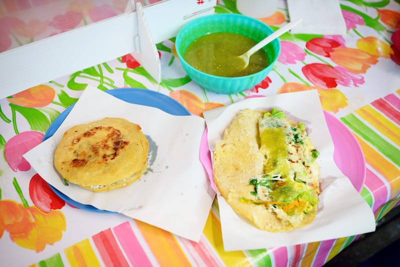 A gordita with chicharrón (left) and a quesadilla with squash blossoms (right) at Quesadillas La Chaparrita in Mercado Jamaica, photo by PJ Rountree
