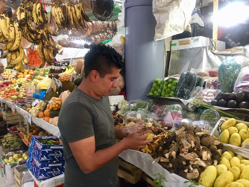 Josué Barona at his stall in Mercado San Juan, photo by Susannah Rigg