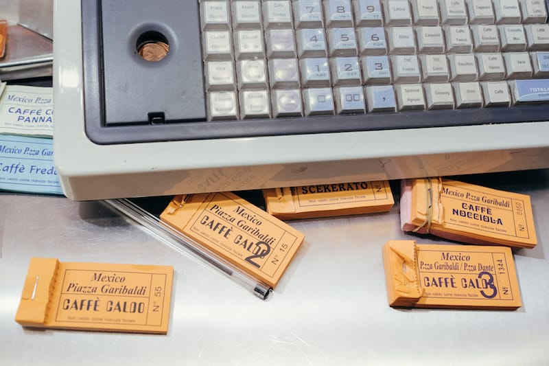 Caffè Mexico has a unique system for buying coffee: you first pay the cashier, who then hands you a receipt and a colored coupon that you bring to the counter, photo by Carlo Rainone