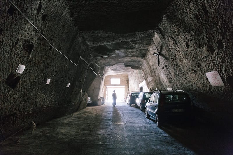 A customer enters the garage of Cantina del Gallo, photo by Gianni Cipriano and Sara Smarrazzo