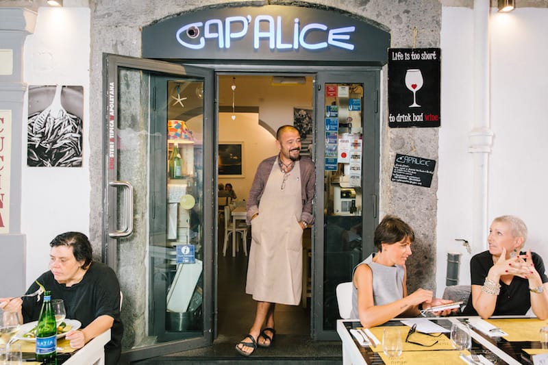 Mario Lombardi stands in the door of his restaurant, Cap’alice, photo by Gianni Cipriano and Sara Smarrazzo