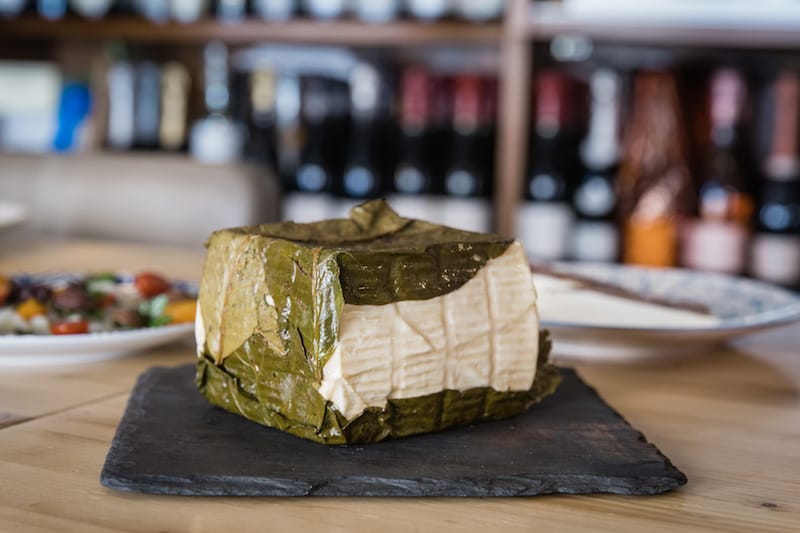 Goat milk cheese from Castel di Sassa, aged with walnut leaves, at Caseari Cautero in Naples, photo by Gianni Cipriano and Sara Smarrazzo