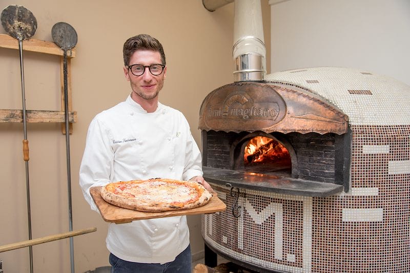 The young chef Cristian Santomauro is the man behind the pizza cilentana, also called the ammaccata, photo by Marco Ciullo