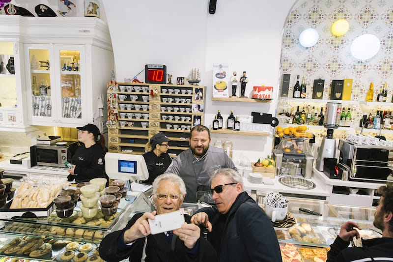 Ciro Poppella, smiling for a selfie at his pastry shop, is an important figure in the Sanità neighborhood, photo by Gianni Cipriano and Sara Smarrazzo
