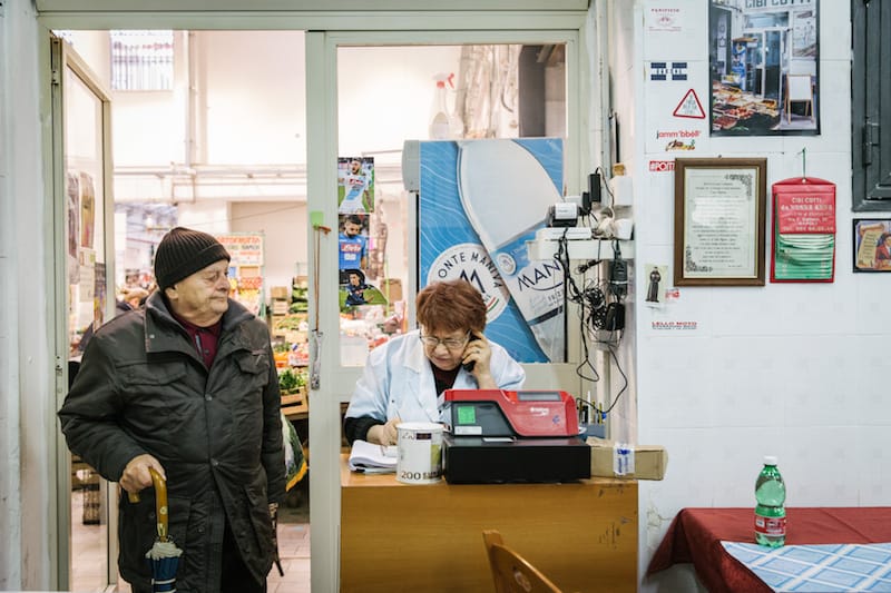 Concetta works the till at Cibi Cotti Nonna Anna, photo by Gianni Cipriano and Sara Smarrazzo