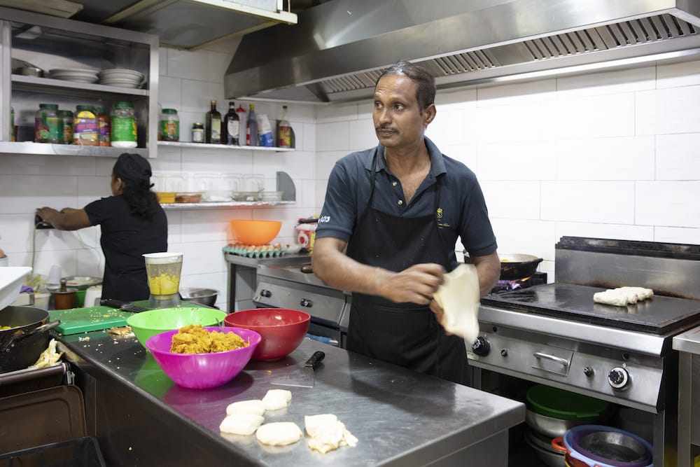 The cook at the Grand Ceylon flings flat bread like a pizza before stuffing it with curry, photo by Amedeo Benestante
