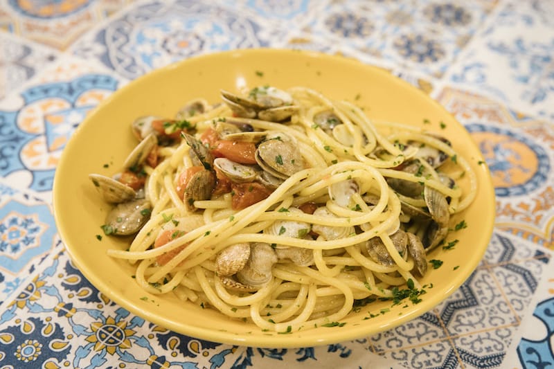 Prepping one of the many seafood dishes at A Taverna d’ ‘e Zoccole in Naples, photo by Gianni Cipriano and Sara Smarrazzo