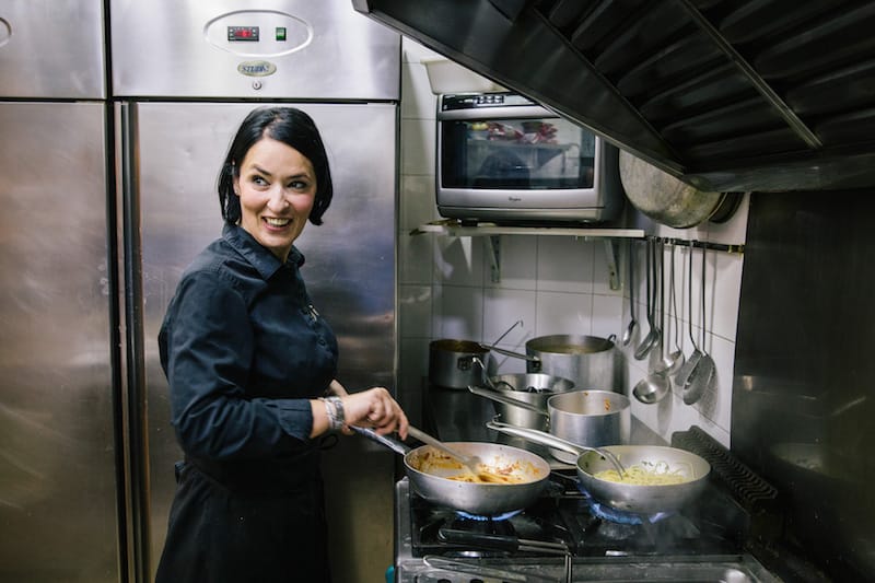 Giusy Aiese cooks in the kitchen of La Taverna del Buongustaio, the restaurant she co-owns with her father, photo by Gianni Cipriano and Sara Smarrazzo
