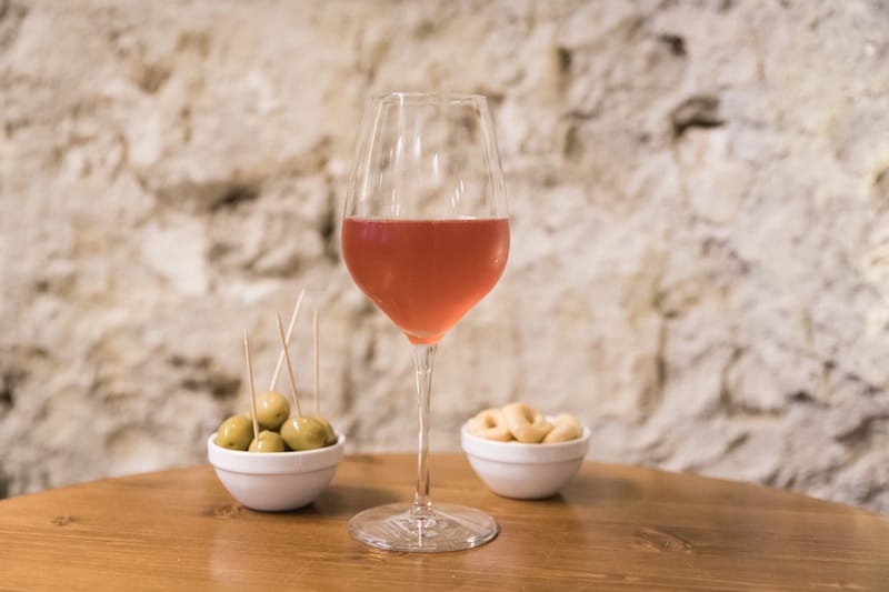 A glass of Sampagnino Bulli, sparkling rosé wine, at Vineria Bandita, photo by Gianni Cipriano and Sara Smarrazzo natural wine naples