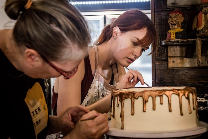 Decorating a cake at Bywater Bakery, photo by Pableaux Johnson