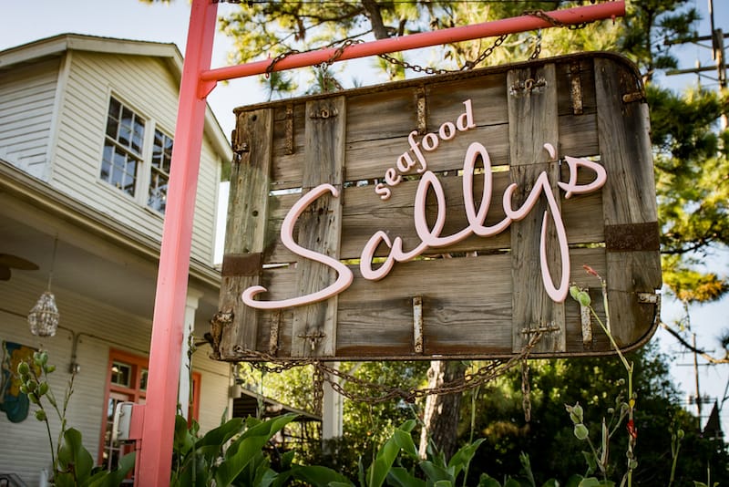 The sign out front at Seafood Sally’s, made from an repurposed trawling board , photo by Pableaux Johnson