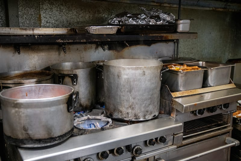Inside the kitchen at Two Sistas ’N Da East, New Orleans, photo by James Cullen
