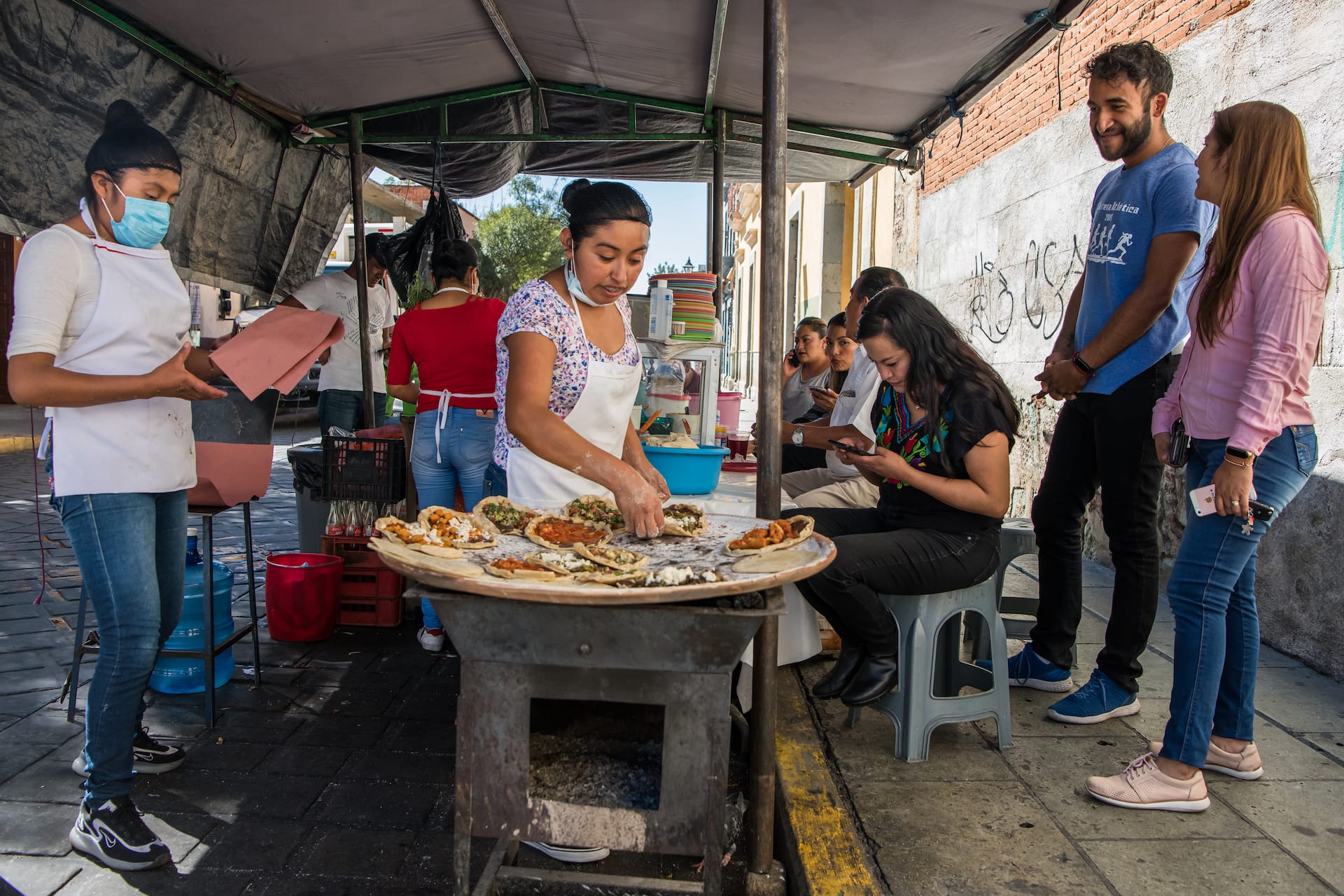 making memelas on a comal