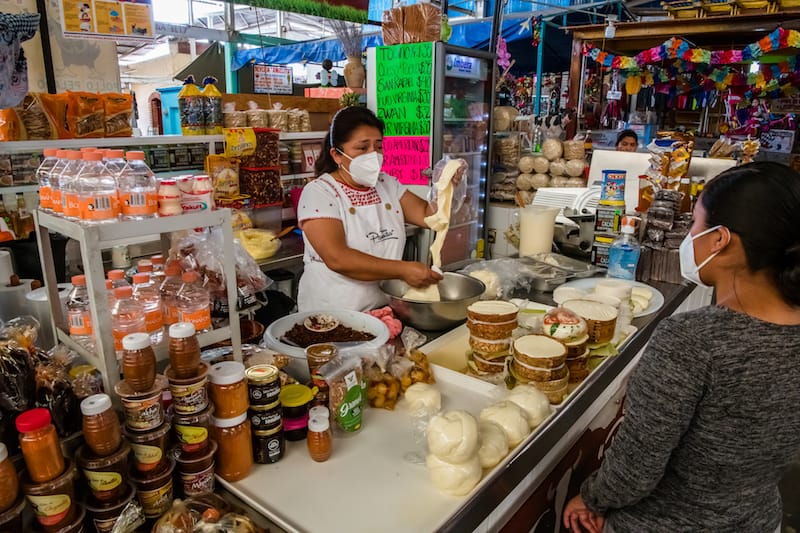 Aurora Vasquez Santiago, the owner of Quesería Panchita, sells quesillo at one of her two small stands, photo by Jalil Olmedo