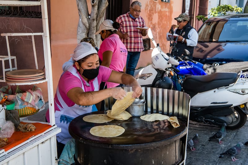 Working the comal at Tacos de Cazuela del Carmen Alto, photo by Jalil Olmedo