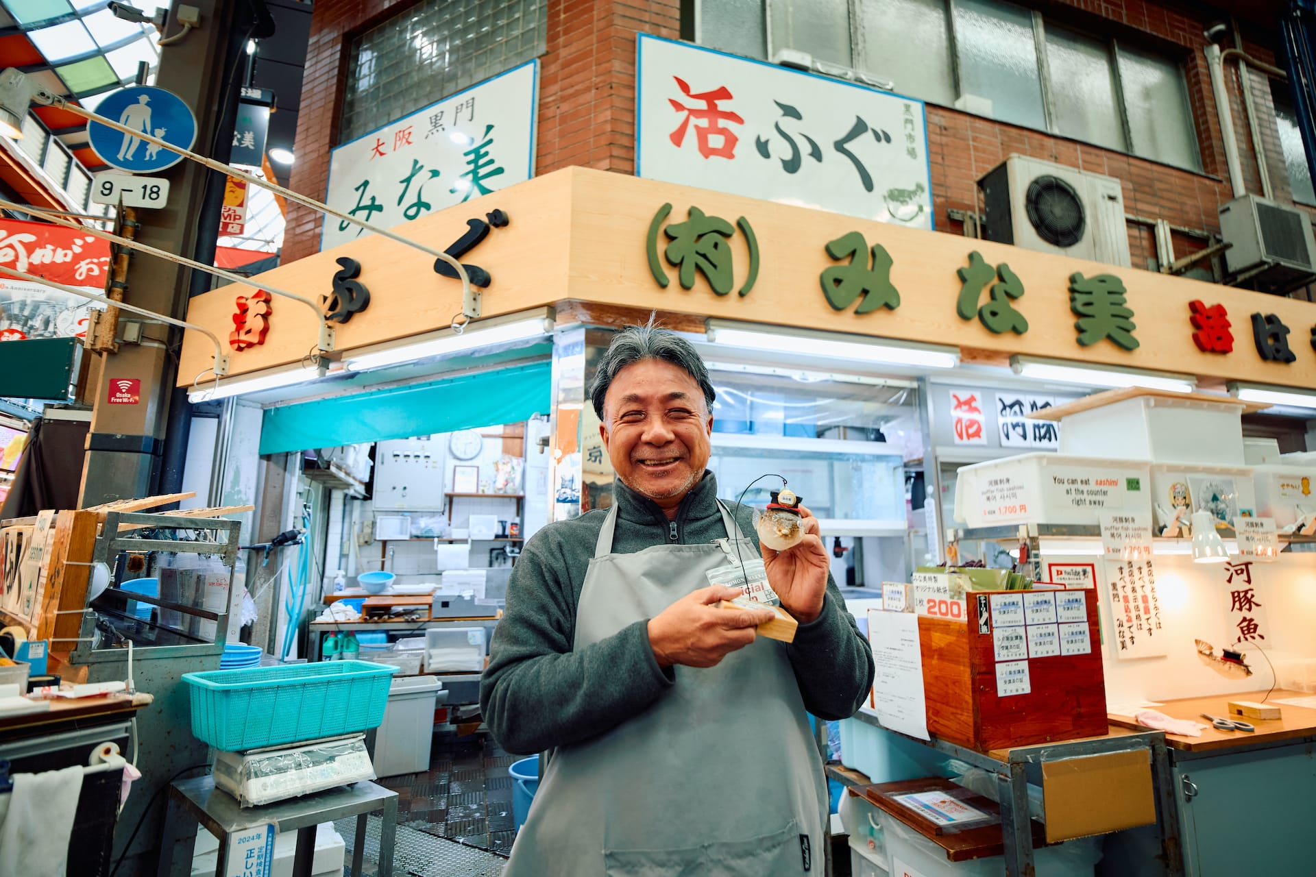 man holding pufferfish