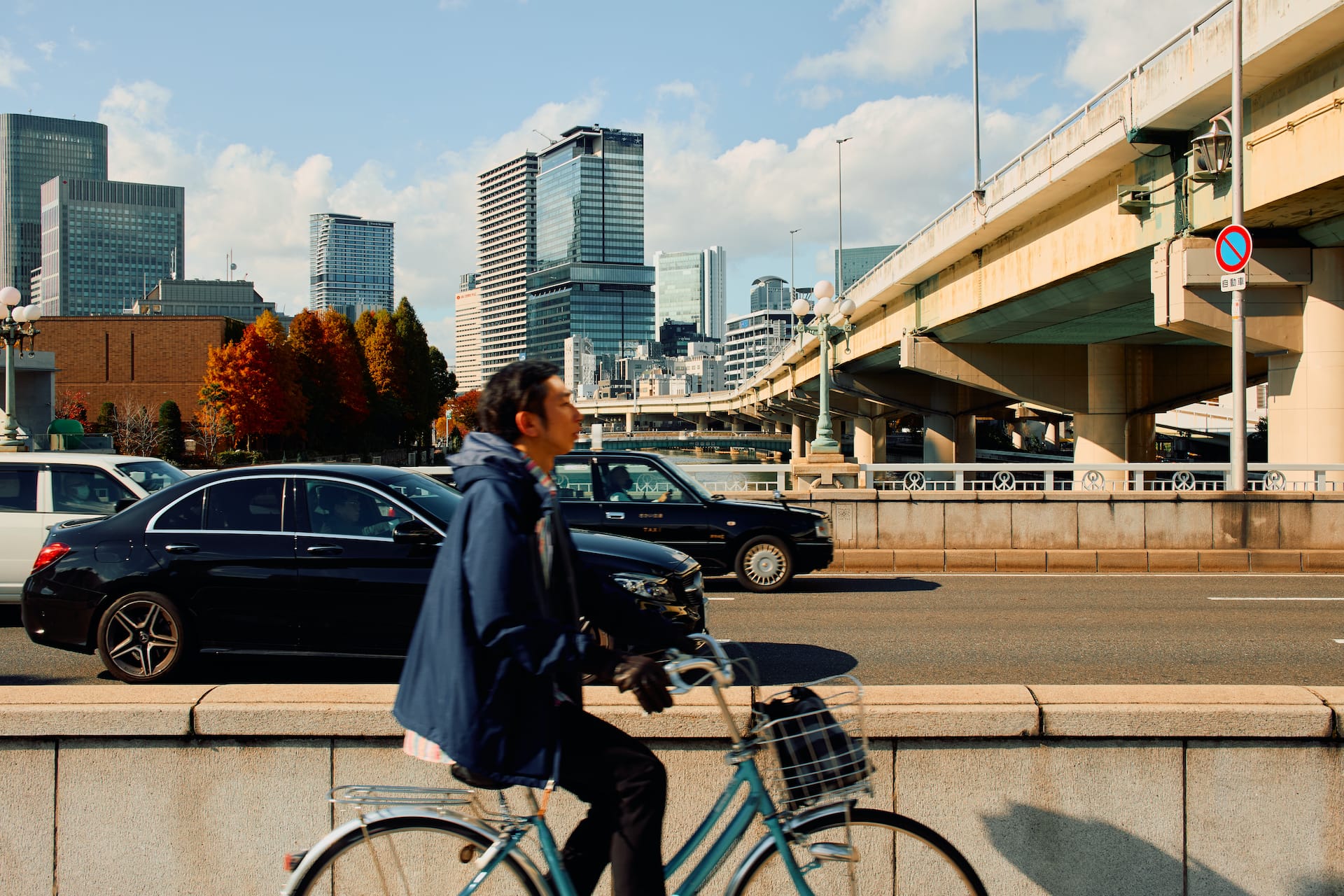 man biking on bridge