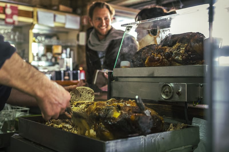 Making a pork knuckle sandwich at Casa Guedes, photo by António Morais porto best food