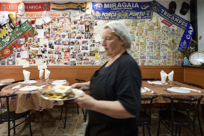 Clarice Santos serves food at Refúgio 112, her restaurant in Porto’s Miragaia neighborhood, photo by Ricardo Castelo
