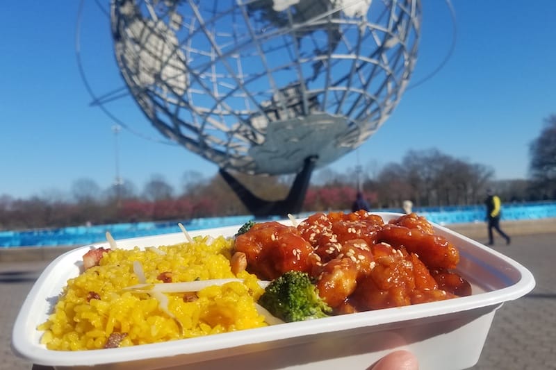 Eating sesame chicken at Flushing Meadows Park, photo by Esneider Arevalo