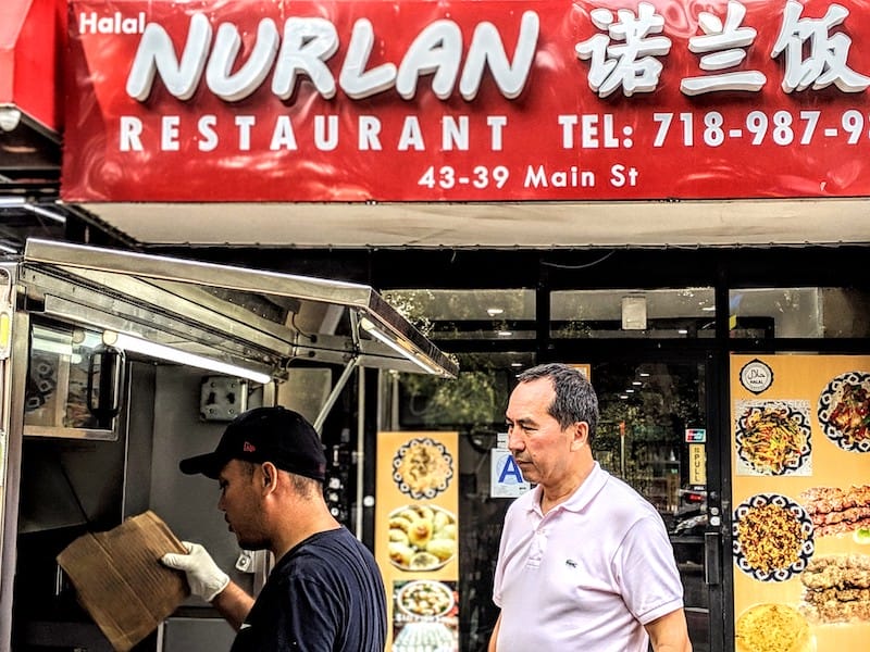 Ekrem (l) and Adil (r) in front of Nurlan in Queens, photo by Jared Cohee uyghur restauran flushing queens