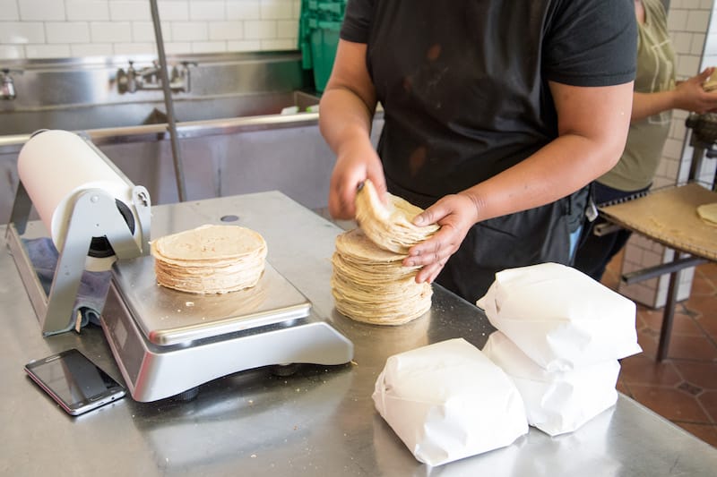 Weighing flour tortillas in Queens, photo by Melanie Einzig