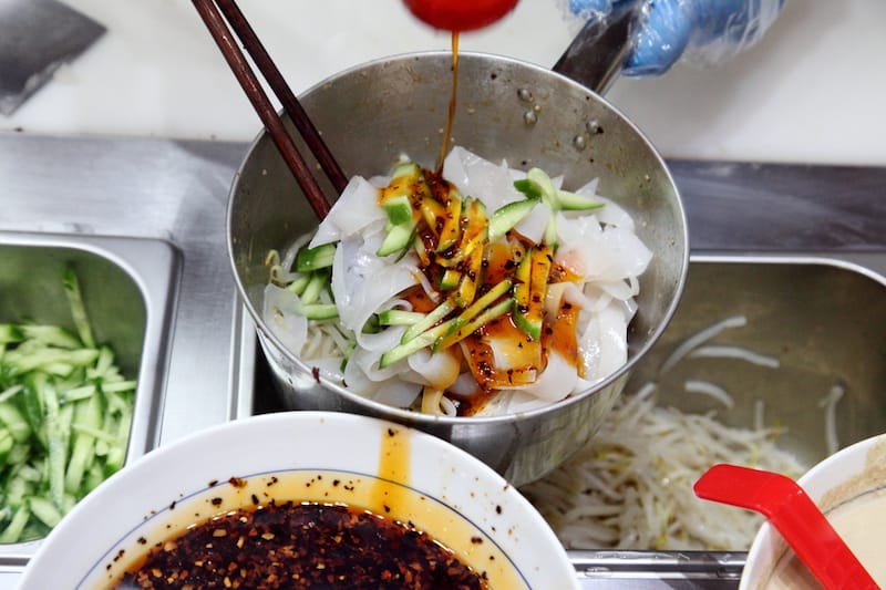 Dressing liang pi at Liang Pi Wang, photo by Dave Cook u.s. open food guide