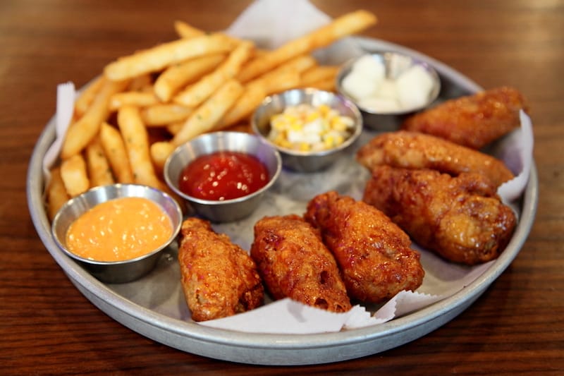 Chicken wings and fries at The Coop, photo by Dave Cook u.s. open food guide
