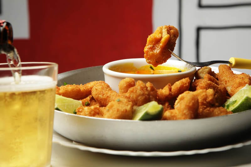 Bolinhos and a cold beer at Baródromo, photo by Berg Silva