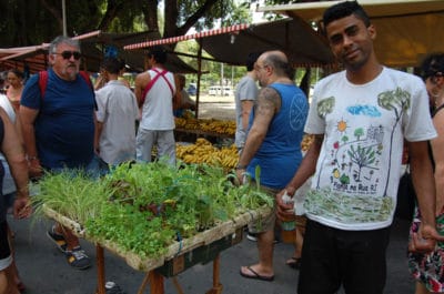 Jonathan sells seedlings at Feira da Glória, photo by Taylor Barnes