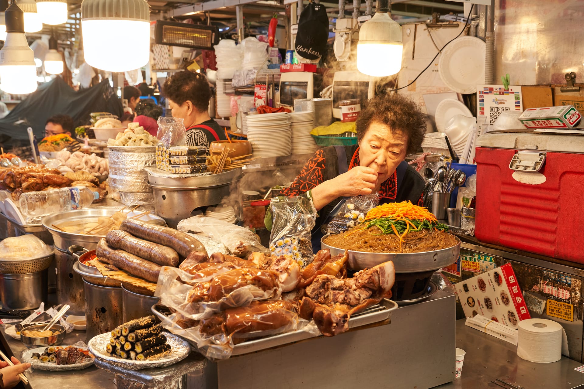 photo of woman eating food in seoul