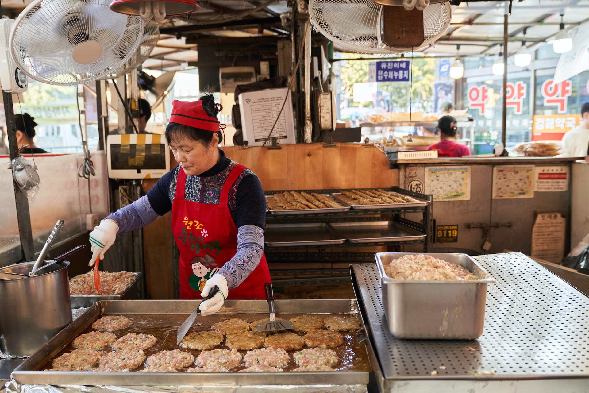 woman making mung bean pancakes