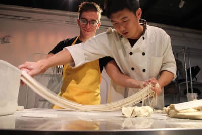 A student learns how to make hand-pulled noodles at Chinese Cooking Workshop, photo by UnTour Shanghai