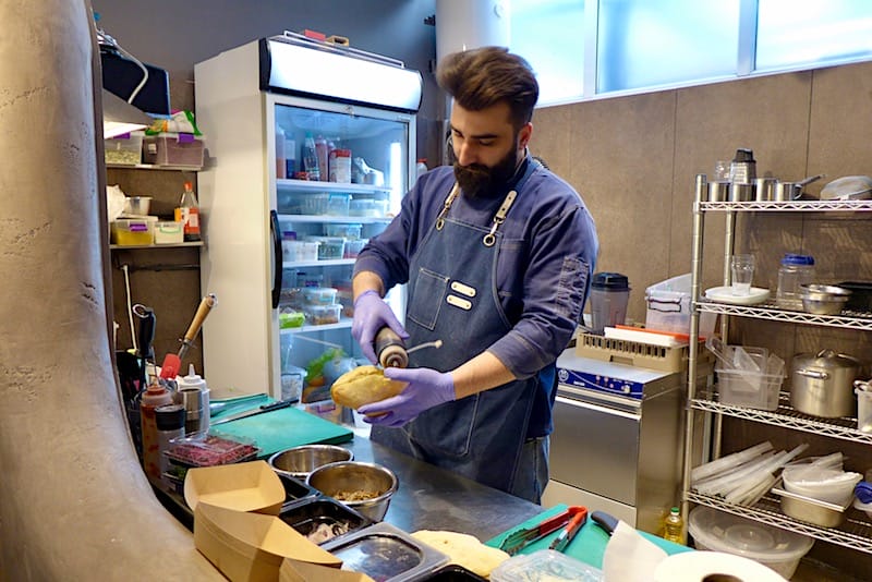 Aluda Arabuli of Shoti prepares a sandwich, photo by Clément Girardot