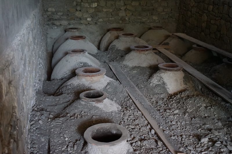 Qvevri being “planted” in a new marani, or wine cellar, photo by Lisa Granik