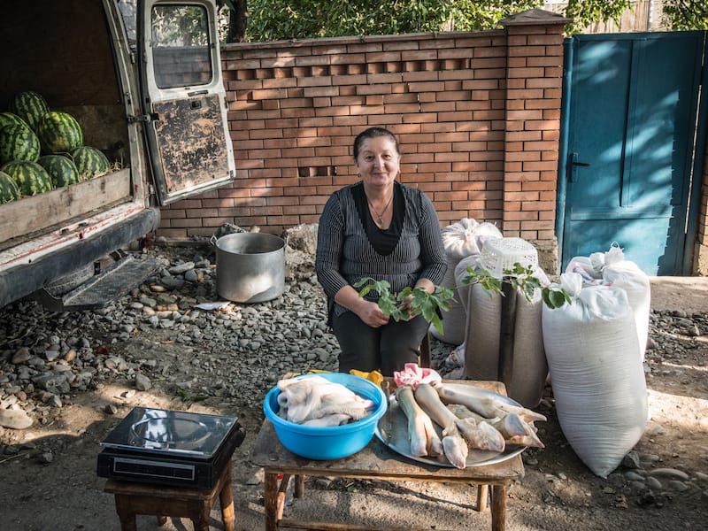 Woman selling tripe and shanks for khashi at the Sunday bazaar in Garikula, photo by Paul Rimple
