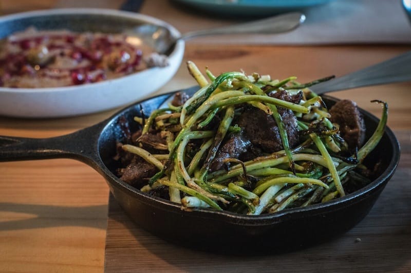 Slow-cooked veal shanks in wild garlic, photo by Justyna Mielnikiewicz