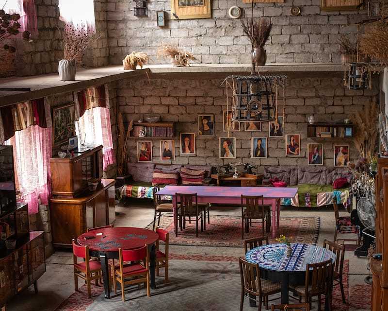 The family's enormous living room, which is where they serve guests, feels as cavernous as an airplane hangar, photo by Justyna Mielnikiewicz