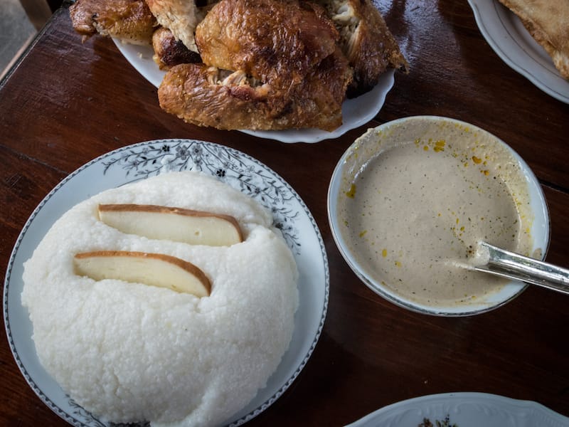 Ghomi (a thick polenta), chicken and bazhe sauce, photo by Justyna Mielnikiewicz